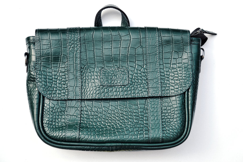 Green textured handbag on a white background